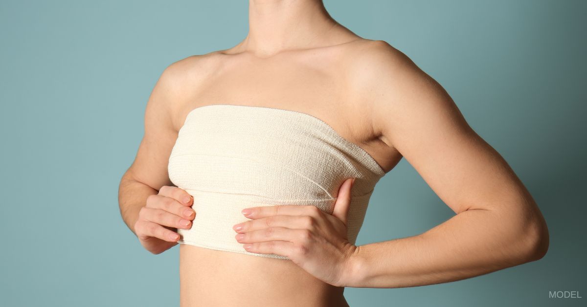 blog-image - Breast Lift Scares: What to Expect As You Heal A woman with a bandage wrapped around her chest. (Model)