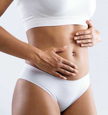 Close up of female beautiful body over grey background Body Lift in Savannah, GA