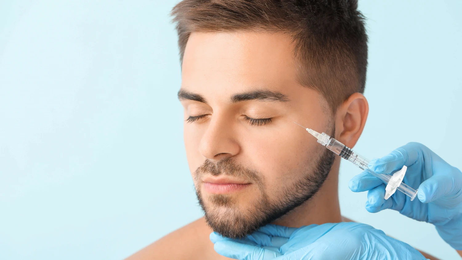 a man undergoing a Botox procedure, showcasing the process of cosmetic enhancement.